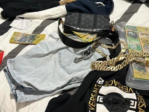 An image depicting cash and bling posted on alleged Melbourne drug dealer Johnny Booth’s Facebook page.