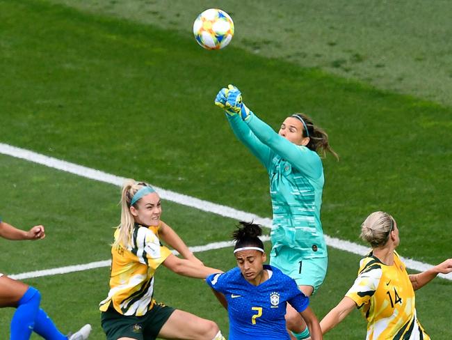 Lydia Williams punches clear against Brazil. Picture: AFP