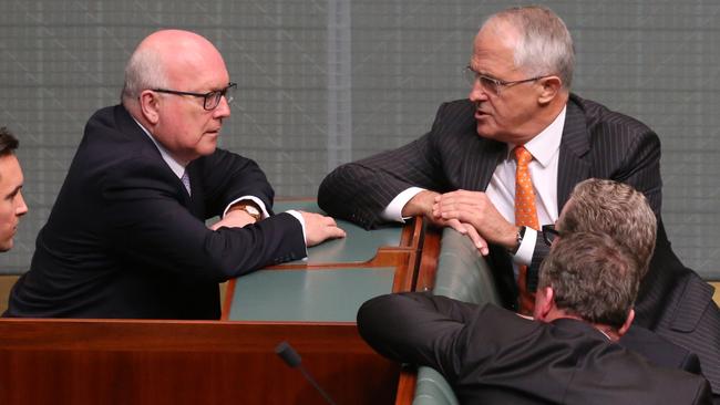 Attorney General Senator George Brandis offers PM Turnbull and his front bench advice from the advisors box in the Reps Chamber tonight. Picture: Ray Strange.