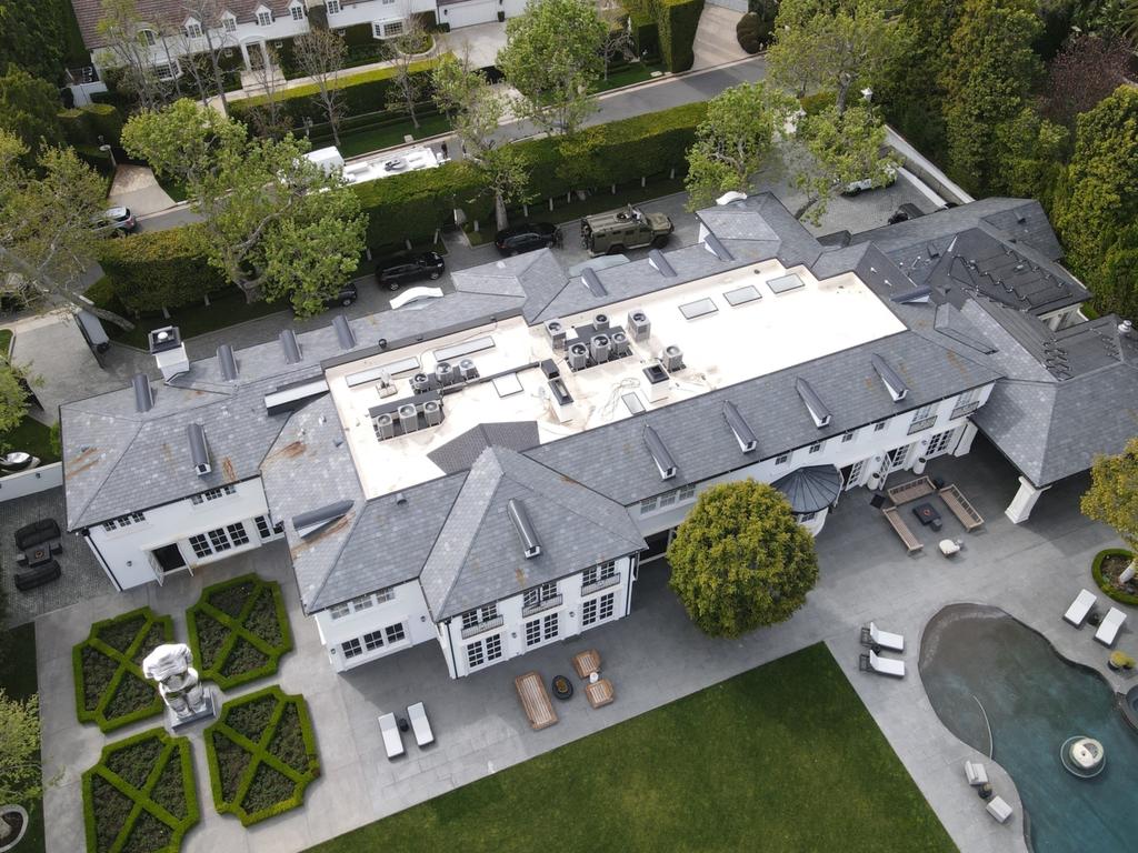 An aerial view of Diddy’s Los Angeles home, with police vehicles seen on the property’s driveway. Picture: Shabba / BACKGRID