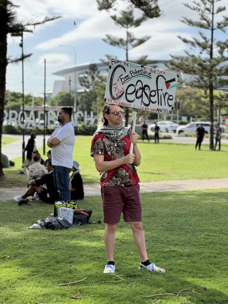 A protester holding a 'Ceasefire' poster at a Palestine solidarity rally held at Victoria Park, Broadbeach on 18.11.23. Picture: Amaani Siddeek