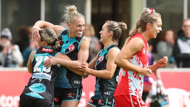 ADELAIDE, AUSTRALIA - SEPTEMBER 17: Kate Surman of the Power celebrates a goal with Erin Phillips during the 2022 S7 AFLW Round 04 match between the Port Adelaide Power and the Sydney Swans at Alberton Oval on September 17, 2022 in Adelaide, Australia. (Photo by Sarah Reed/AFL Photos via Getty Images)