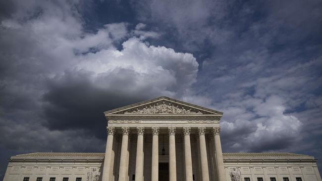 Clouds are seen gathering above The US Supreme Court. Picture: AFP