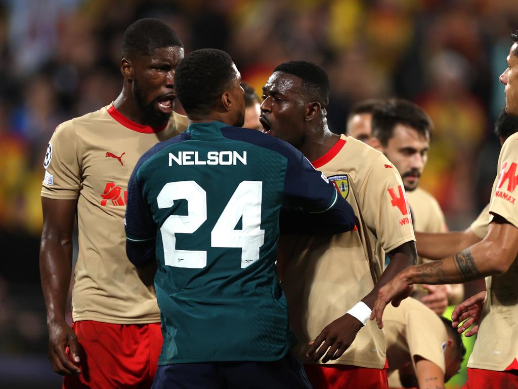 LENS, FRANCE - OCTOBER 03: Neiss Nelson of Arsenal clashes with Salis Abdul Samed of Lens during the UEFA Champions League match between RC Lens and Arsenal FC at Stade Bollaert-Delelis on October 03, 2023 in Lens, France. (Photo by Alex Pantling/Getty Images)
