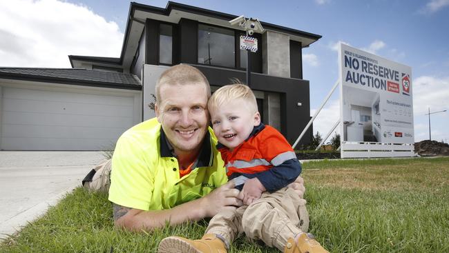 Jordan Hornsey, who helped build the charity house, with his son Oliver. Picture: David Caird