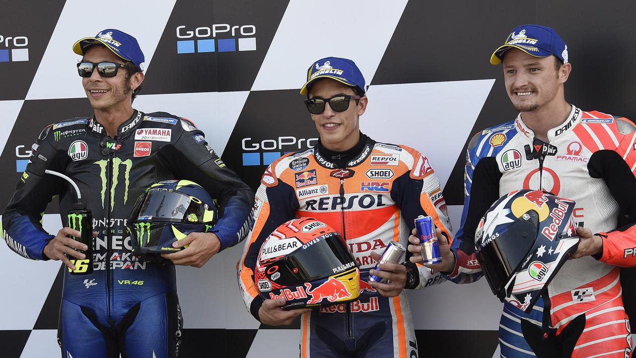 (L-R) Valentino Rossi, Marc Marquez and Jack Miller pose at the end of the qualifying.