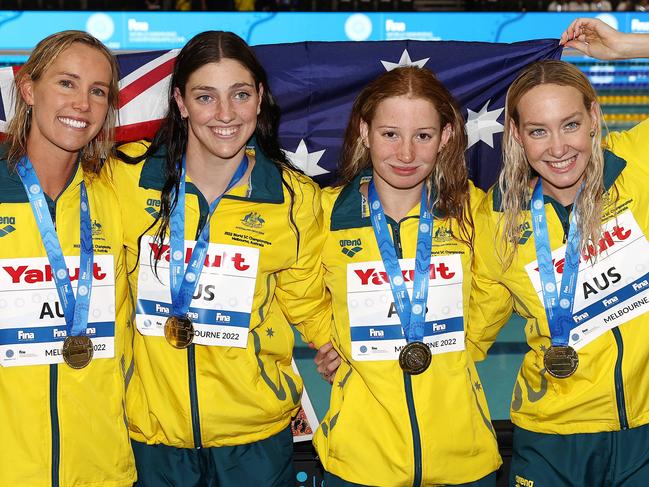 MELBOURNE . 13/12/2022. World Short Course Swimming Championships at Melbourne Sports and Aquatic centre, Melbourne.  The Australian 4 x 100 mtr women relay team. , Emma McKeon, Meg Harris, Mollie OÃCallaghan  and  Madi Wilson after winning gold and breaking the world record  . Picture by Michael Klein