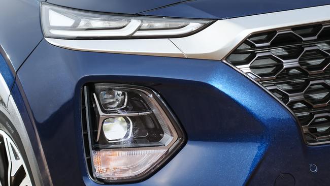 Light the way: Santa Fe stacks daytime running lights above the low and high-beam lamps.