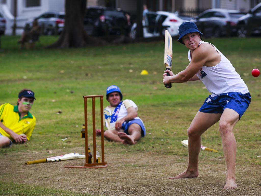 Australia Day at Watson's Bay. Joel Ellis bats in a game of cricket in the park with mates. Photo: Dylan Robinson