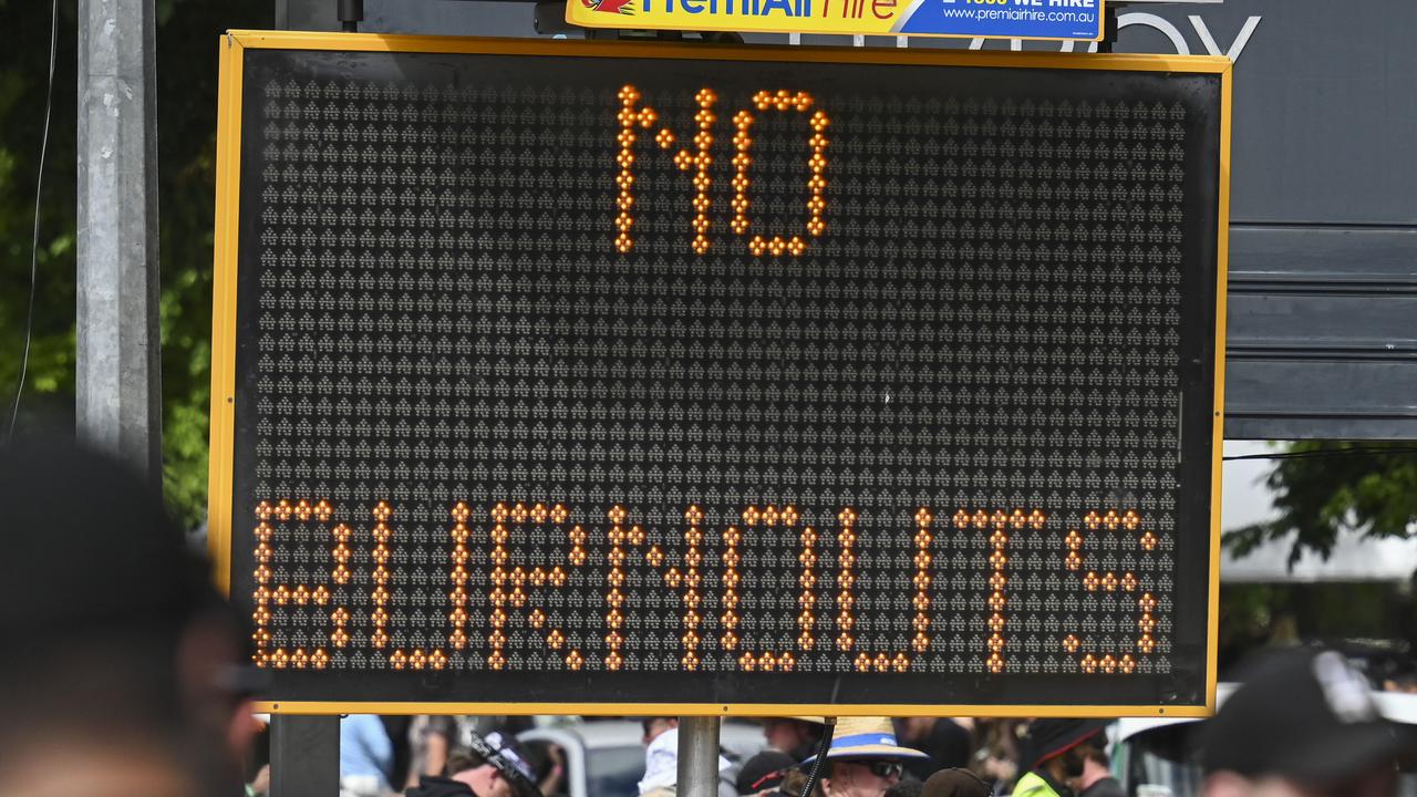 A police sign warning of burnouts at the event.