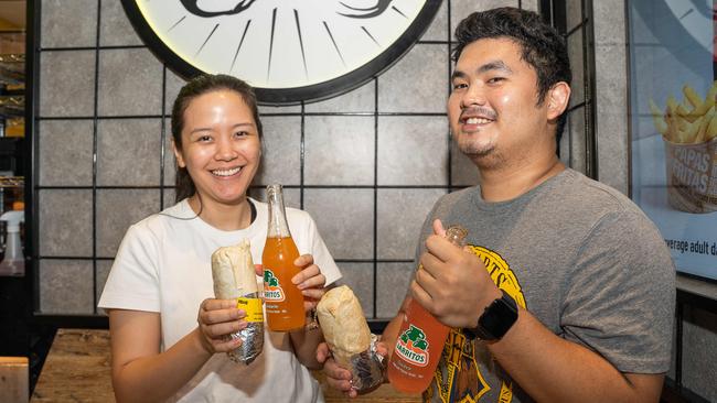 Jill and Tom enjoying their burritos as Guzman Y Gomez opens in Stuart Park, Darwin. Picture: Pema Tamang Pakhrin