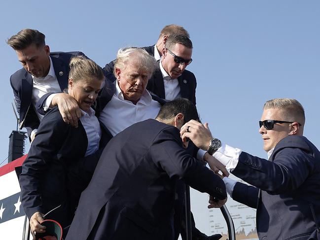 Republican presidential candidate former US president Donald Trump is rushed offstage during a rally after being shot at. Picture: Anna Moneymaker/Getty Images/AFPGetty Images via AFP