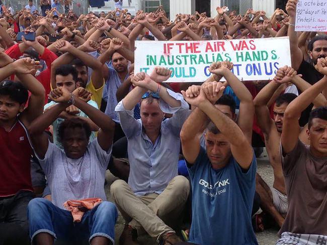 Greens Senator for Tasmania Nick McKim with refugees gesturing inside the Manus detention camp in Papua New Guinea on the day of the camp's closure. Picture: Nick McKim/AFP