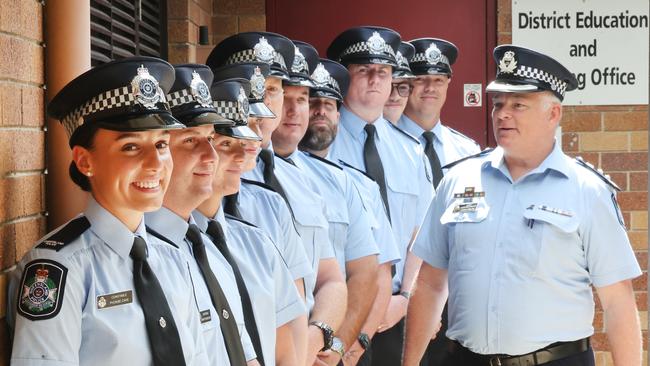 First year constables for the Gold Coast, with Constable Phoebe Cave and Constable Marty Burovski at the front, get the once over from Chief Superintendent Craig Hanlon at Mudgeeraba Police Station. Picture: Glenn Hampson