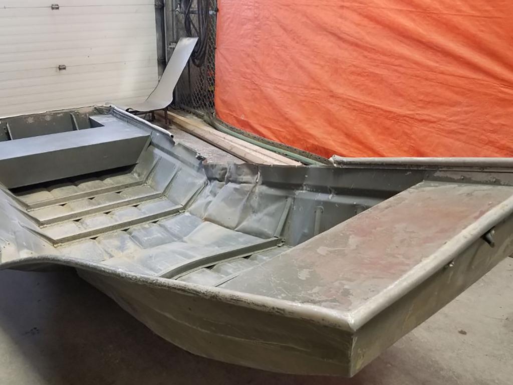 The damaged aluminium boat found near the shoreline of the Nelson River on August 3. Picture: RCMP