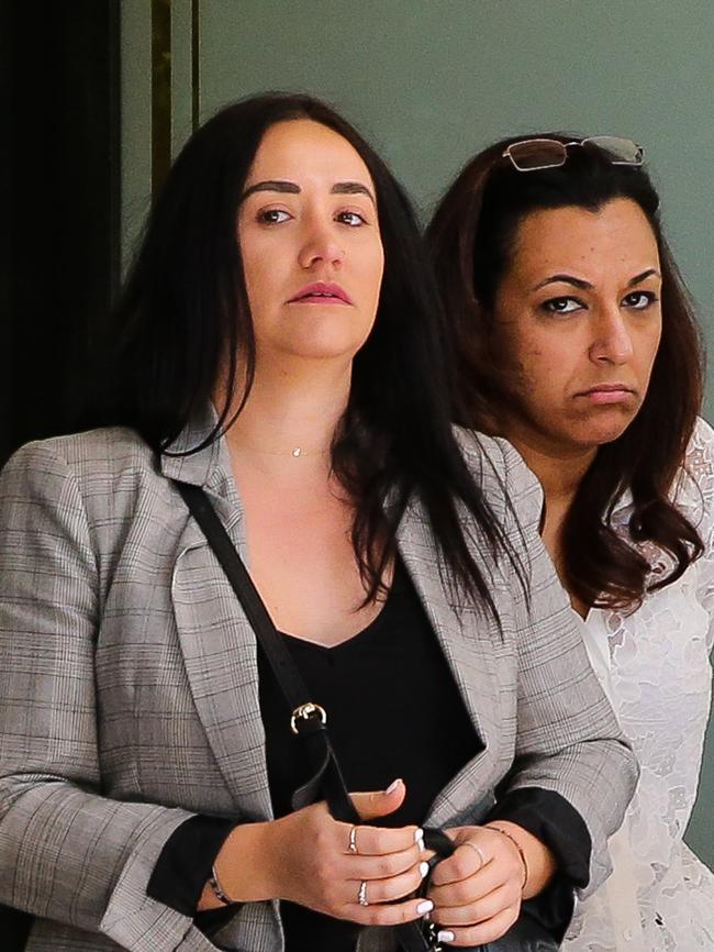 Stefania Giacchi 31 (left) leaves court with a supporter. Picture: Gaye Gerard