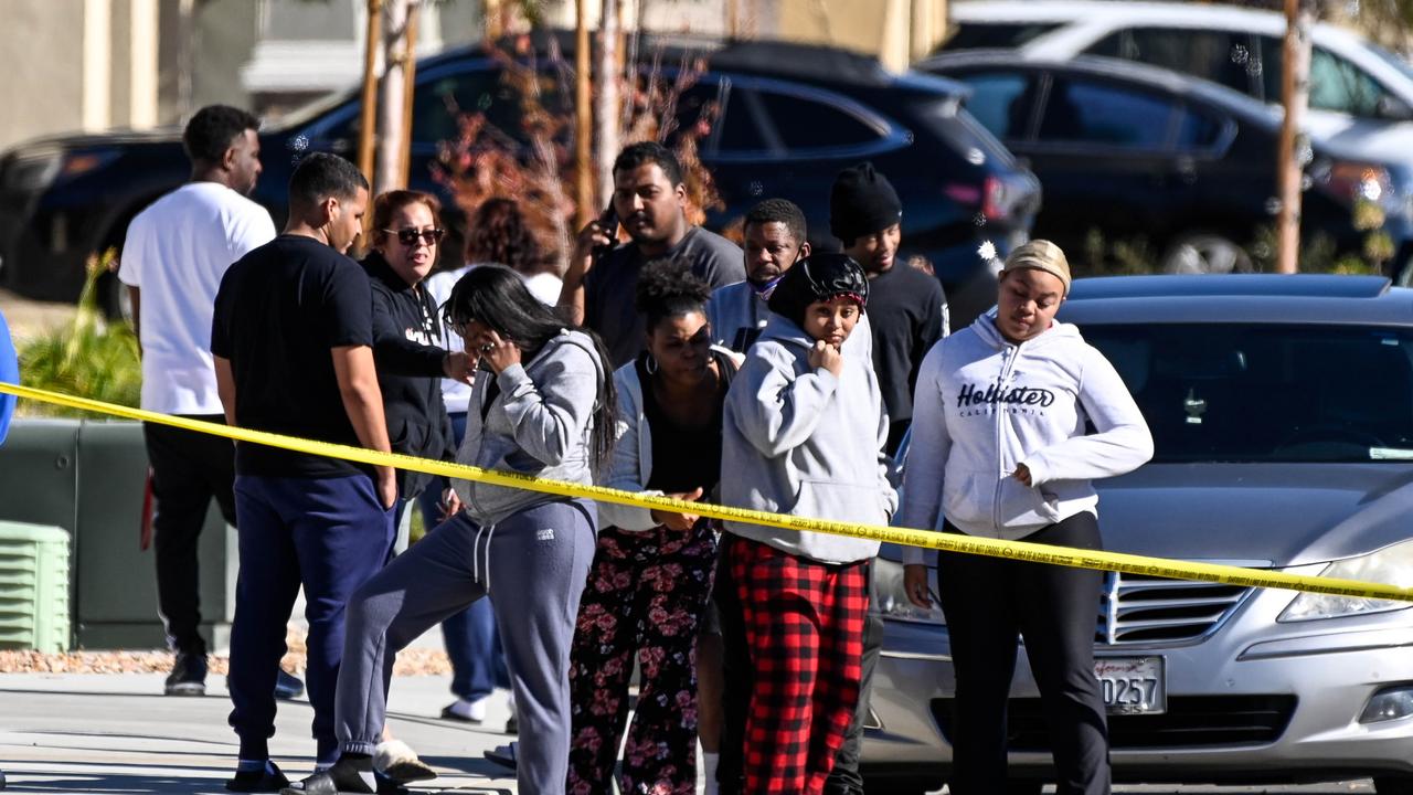 Onlookers at the scene of the shooting. Picture: David Crane/MediaNews Group/Los Angeles Daily News/Getty Images.