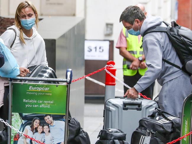 On the lookout for Oz Open players. People arrive on SkyBus at the Grand Hyatt123 Collins St, Melbourne. Picture: Tim CarrafaAngelique Kerber in white