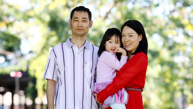 Chinese migrants Min Zhu and June Zhu, with their daughter Olivia. Picture: Hollie Adams