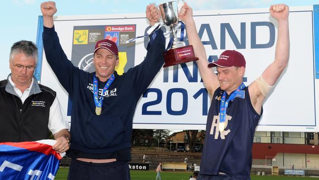 Rosebud coach Nick Jewell and captain Ryan Spooner with the premiership trophy. Picture: Andrew Henshaw