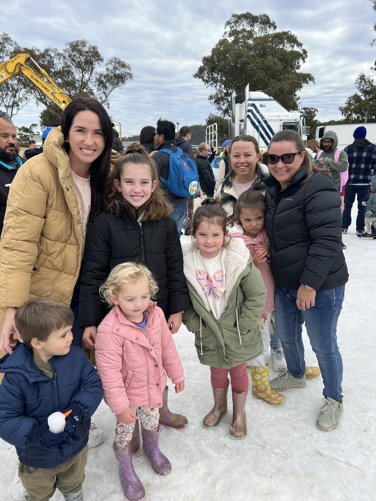 Family friends Zoe, Arlia, Zari, Skyla (L) and Amy, Christie, Mila and Sam (R) having a 'snow' good time at Snowflakes in Stanthorpe on Saturday, July 1 2023.