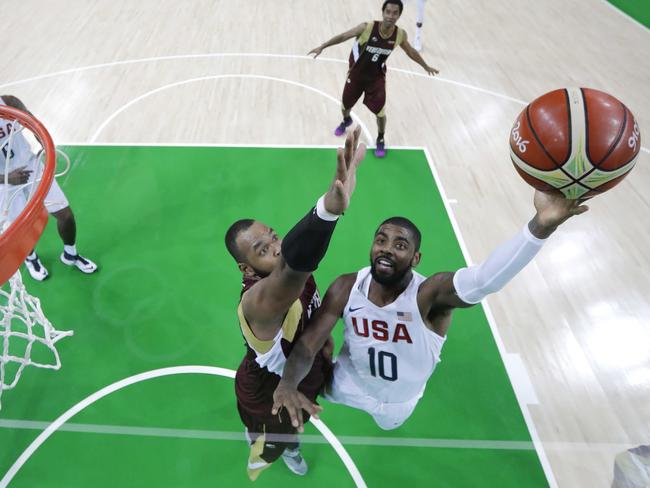 Kyrie Irving drives to the basket against Venezuela.