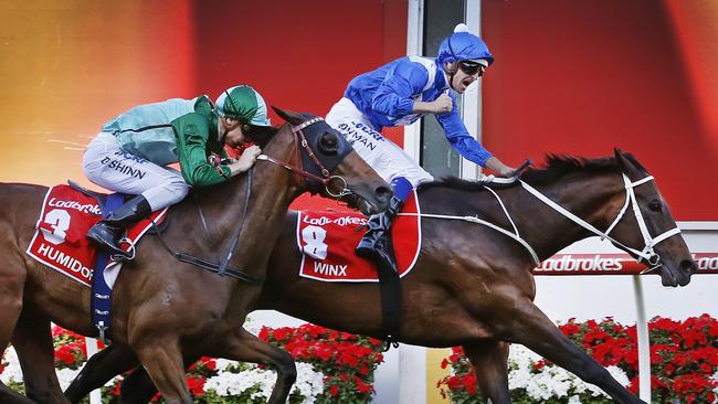 Winx beats Humidor in the Cox Plate. Picture: David Caird