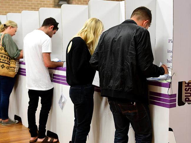 Voters are seen in the electorate of Wentworth at North Bondi Primary School on Election Day in Sydney, Saturday, 18 May, 2019. Approximately 16.5 million Australians will vote in what is tipped to be a tight election contest between Australian Prime Minister Scott Morrison and Australian Opposition leader Bill Shorten. (AAP Image/Bianca De Marchi) NO ARCHIVING