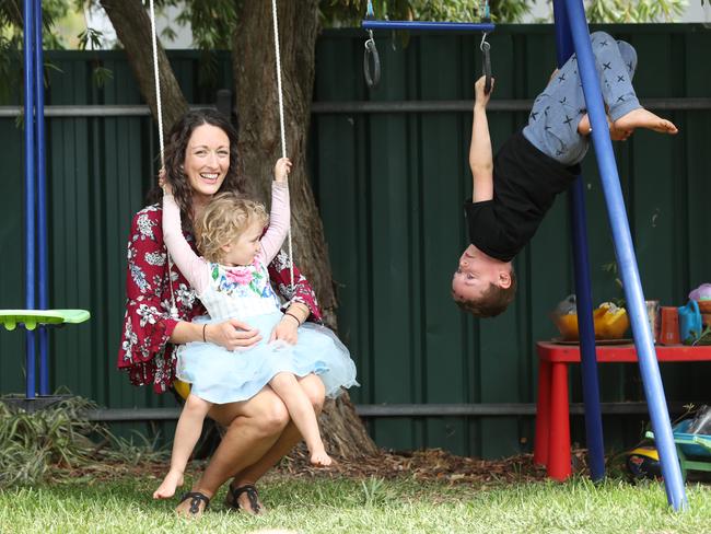 30.3.2020.Charlotte Reimer of Magill with her children Chelsea,3 and Brucey,6 having fun on playground equipment at home. PIC TAIT SCHMAAL.