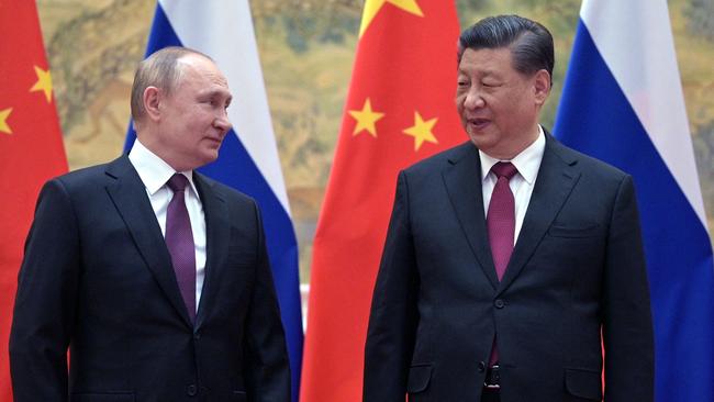 Vladimir Putin and Xi Jinping strike the ‘no limits’ freindship between Russia and China in Beijing on February 4. Picture: AFP