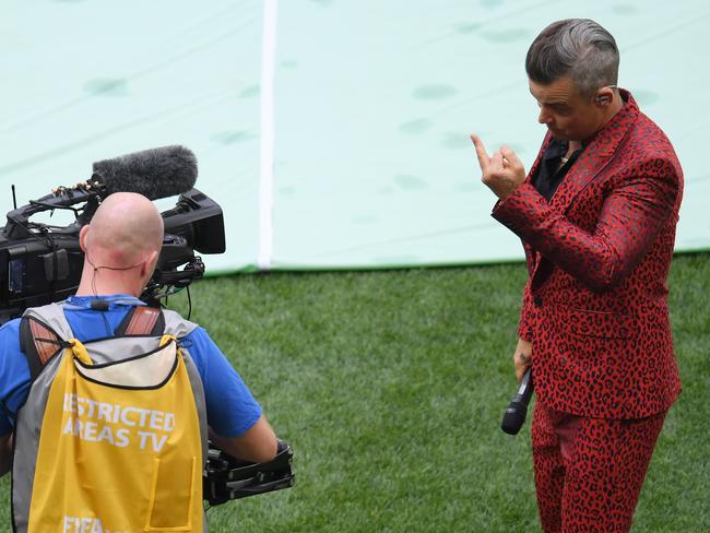 Robbie Williams Wears a Red Leopard Print Suit to Perform at the World Cup  in Russia