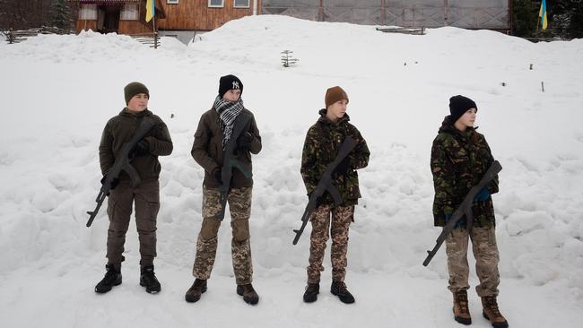 Four 14-year-old boys during tactical training in Skole, Ukraine, at the weekend. Picture: Getty Images