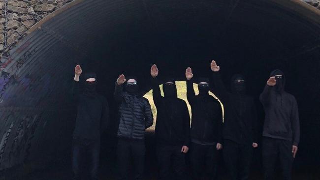 Neo-Nazi group the National Socialist Network's Adelaide members gather to perform the Hitler salute.