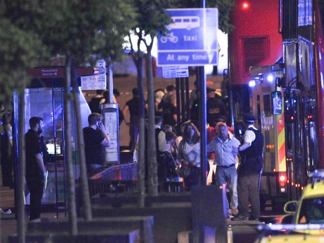 Police escort members of the public at the scene of a terror attack on London Bridge. Picture: AFP