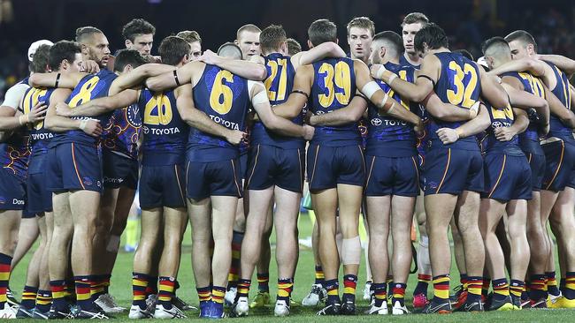 Adelaide players link up at three-quarter time. Picture: Sarah Reed