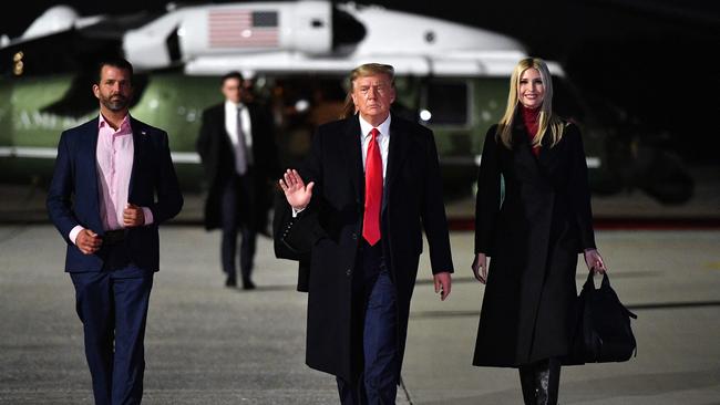 Ivanka Trump and Donald Trump Jr. (L) make their way to board Air Force One with Donald Trump before departing from Dobbins Air Reserve Base in Marietta, Georgia last year.