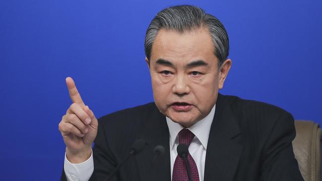 ‘Looming head-on collision’: Wang Yi in Beijing yesterday.