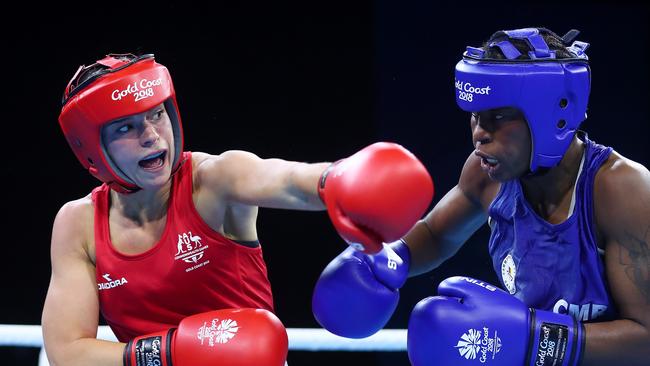 Australia’s Skye Nicolson lands a left hand on Christelle Aurore Ndiang of Cameroon in their women's 57kg boxing quarter-final. Photo: Getty Images