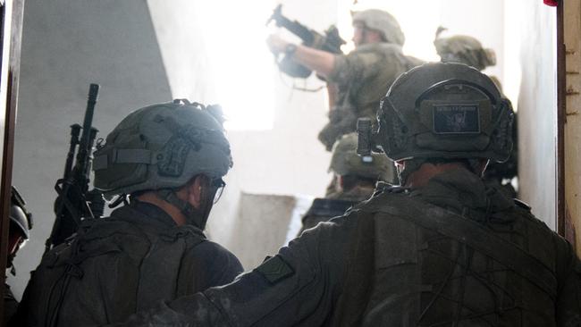 This handout picture released on August 14 shows Israeli army soldiers operating in the Gaza Strip. Picture: Israeli Army / AFP