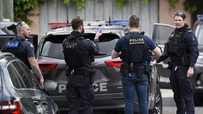 Police block off Cluden Street. Picture: Andrew Henshaw