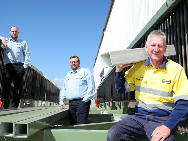 Denis Wagner (right) with production manager Brandon Simpson and CFO Fergus Hume with one of the bridges they have developed using concrete and fibre technology and now selling across the globe. Picture: Liam Kidston