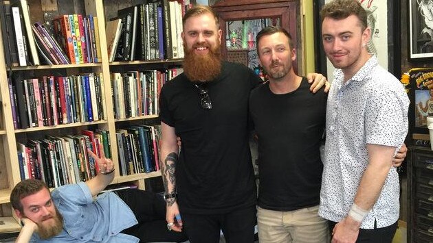 Tattooist Rhys Gordon with Sam Smith (far right). Picture: Supplied