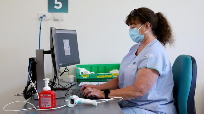 Nurse Jeannette Jarick prepares for vaccination. Picture: Toby Zerna