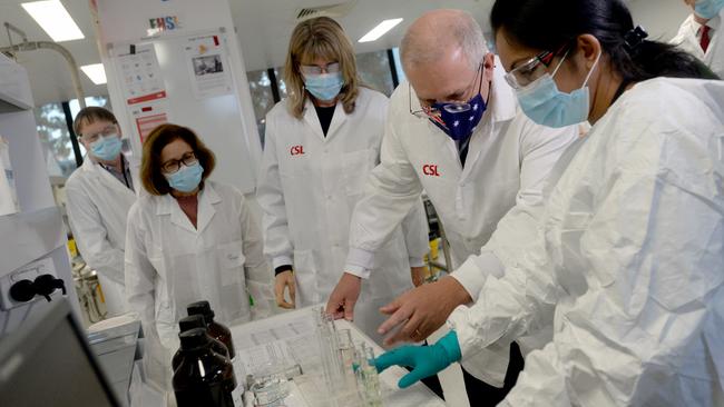 Scott Morrison meets CSL staff working on the COVID vaccine while he toured the company's facility in Melbourne in March. Picture: Andrew Henshaw