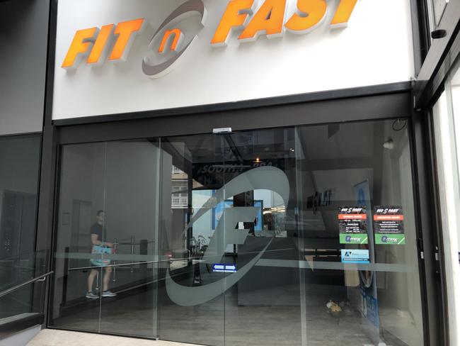 A lone staff member is seen walking into Fit n Fast in South Yarra.