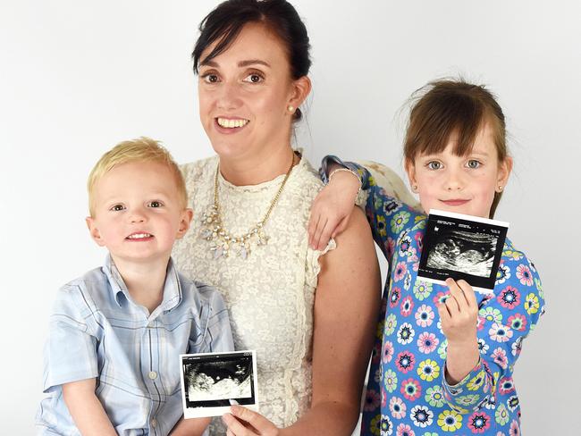 Faye Wilkins with her two children George, 2, and Molly, 7, at their home in Plymouth, Devonshire.