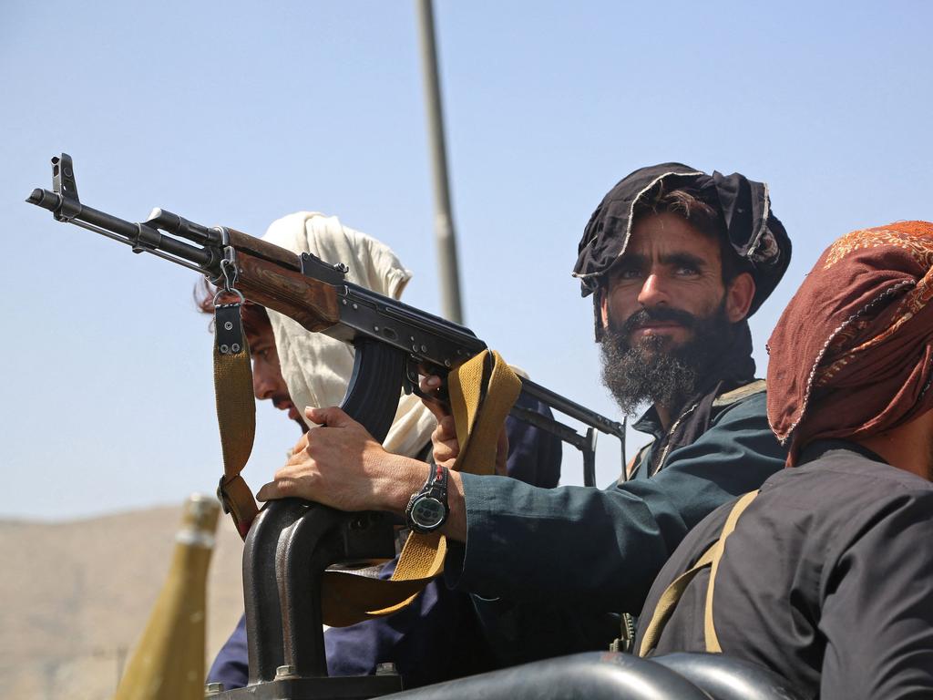 Taliban fighters stand guard in a vehicle along the roadside in Kabul on August 16, 2021. Picture: AFP