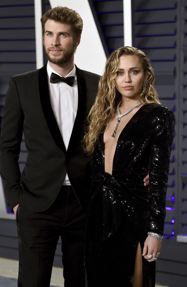 Liam Hemsworth and Miley Cyrus at the Vanity Fair bash. Picture: AP