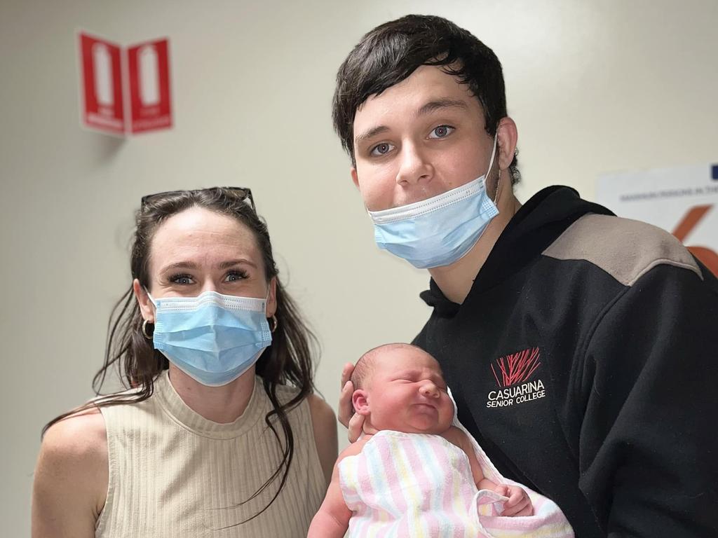 18-year-old Kingsley 'Junior' Alley holding his newborn daughter Eleanor, with step-mum Kylie Simmonds.