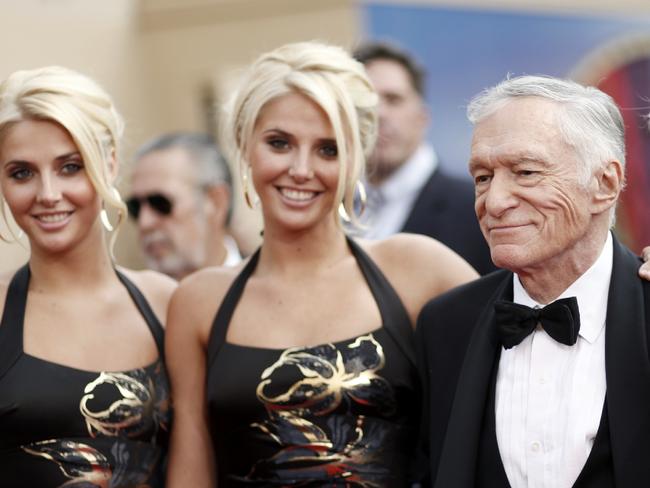 Identical twins Karissa and Kristina Shannon, Hugh Hefner at the taping of the American Film Institute Life Achievement Awards. Picture: AP